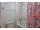 Bright bathroom with a shower and tub featuring a stylish floral shower curtain at 253 Golden Sands Cir, Davenport, FL 33837