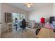 Bright bedroom with a desk, office chair, and sewing machine at 253 Golden Sands Cir, Davenport, FL 33837