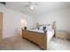 Spacious bedroom features bright white walls, neutral carpet, and light wood furniture at 253 Golden Sands Cir, Davenport, FL 33837