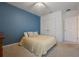 Bedroom featuring a large window, ceiling fan, and spacious closet space at 253 Golden Sands Cir, Davenport, FL 33837