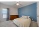 Bright bedroom features a large window, ceiling fan, and plenty of closet space at 253 Golden Sands Cir, Davenport, FL 33837