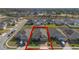 Front exterior of home, featuring a well-manicured lawn, driveway, and landscaped yard at 253 Golden Sands Cir, Davenport, FL 33837