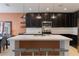 This kitchen features modern pendant lights and a large island with barstool seating at 253 Golden Sands Cir, Davenport, FL 33837