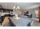 Open floor plan showcases the kitchen with island seating, dining area and living room at 253 Golden Sands Cir, Davenport, FL 33837