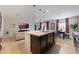 Open concept living area with tile flooring, eat-in kitchen and comfortable seating at 253 Golden Sands Cir, Davenport, FL 33837