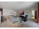 Bright living room featuring carpet, a comfy gray sofa, a modern TV and decor, and an open floor plan at 253 Golden Sands Cir, Davenport, FL 33837