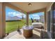 Covered patio with a fire pit, rug, and a hot tub in the backyard at 253 Golden Sands Cir, Davenport, FL 33837