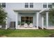 Inviting patio with two adirondack chairs and privacy fence at 2582 Winsome Way, Davenport, FL 33896