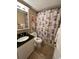 Bathroom with granite countertop and shower/tub combo at 3501 S Atlantic Ave # 6060, New Smyrna Beach, FL 32169