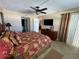 King-size bed, dresser, and en-suite bathroom at 3501 S Atlantic Ave # 6060, New Smyrna Beach, FL 32169