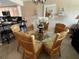Bright dining room with glass-top table and wicker chairs at 3501 S Atlantic Ave # 6060, New Smyrna Beach, FL 32169