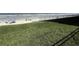Beautiful lawn space with direct beach access just beyond a safety fence at 3501 S Atlantic Ave # 6060, New Smyrna Beach, FL 32169