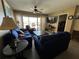 Living room with balcony access and comfy seating at 3501 S Atlantic Ave # 6060, New Smyrna Beach, FL 32169