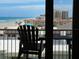 Stunning ocean view from private balcony, featuring a chair and table at 3501 S Atlantic Ave # 6060, New Smyrna Beach, FL 32169