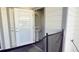 Small half bathroom with pedestal sink and open door at 4114 Lana Ave, Davenport, FL 33897