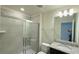 Bathroom with shower, granite vanity, and mirror at 4114 Lana Ave, Davenport, FL 33897