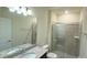 Bathroom with granite vanity, shower and mirror at 4114 Lana Ave, Davenport, FL 33897
