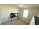 Simple bedroom with carpeted floor, window, and closet at 4114 Lana Ave, Davenport, FL 33897