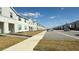 Row of townhouses on a tree-lined street with parking at 4114 Lana Ave, Davenport, FL 33897