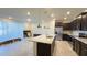 Modern kitchen with granite countertops and stainless steel appliances at 4114 Lana Ave, Davenport, FL 33897