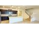 Modern kitchen with dark cabinets, granite counters, and island at 4114 Lana Ave, Davenport, FL 33897