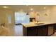 Island kitchen with granite countertops and stainless steel appliances at 4114 Lana Ave, Davenport, FL 33897