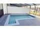 Private pool area with safety fence and covered patio at 4114 Lana Ave, Davenport, FL 33897