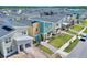 Aerial view of new townhouses with landscaping at 4285 Prologue Way, Kissimmee, FL 34746