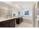Spa-like bathroom with double vanity, soaking tub, and shower at 4285 Prologue Way, Kissimmee, FL 34746