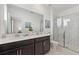 Bathroom with double vanity and walk-in shower at 4285 Prologue Way, Kissimmee, FL 34746