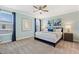 King-size bed, blue color scheme, and modern nightstands at 4285 Prologue Way, Kissimmee, FL 34746