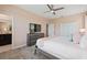 Bedroom with king-size bed, TV, dresser, and en-suite bathroom at 4285 Prologue Way, Kissimmee, FL 34746