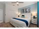 King-size bed, navy blue accents, and large closet at 4285 Prologue Way, Kissimmee, FL 34746