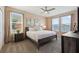 Bedroom with king-size bed and calming decor at 4285 Prologue Way, Kissimmee, FL 34746