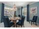 Elegant dining room with a round table and blue chairs at 4285 Prologue Way, Kissimmee, FL 34746