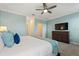 Large main bedroom with TV and dresser at 4285 Prologue Way, Kissimmee, FL 34746