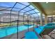 Private screened pool and spa with lounge chairs at 4285 Prologue Way, Kissimmee, FL 34746