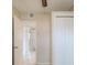 A hallway with tile flooring and open doorways at 451 Rogers St, Orlando, FL 32811