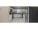 Clean kitchen showcasing stainless steel appliances, white cabinets, tile flooring and granite countertops at 451 Rogers St, Orlando, FL 32811