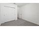 Bedroom featuring neutral carpet and a double-door closet at 4543 Sidesaddle Trl, St Cloud, FL 34772