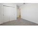This bedroom features neutral carpet and a closet with sliding doors at 4543 Sidesaddle Trl, St Cloud, FL 34772