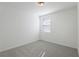 Neutral bedroom featuring carpet and a window with blinds at 4543 Sidesaddle Trl, St Cloud, FL 34772