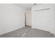 Bedroom featuring neutral carpet and a double-door closet at 4543 Sidesaddle Trl, St Cloud, FL 34772