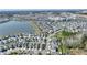 Community aerial view featuring a lake, surrounding residences, and a landscape that creates a vibrant neighborhood setting at 4608 Egg Harbor Dr, Kissimmee, FL 34746
