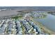 Aerial view showing the property's position within a community near a lake, with streets and surrounding homes visible at 4608 Egg Harbor Dr, Kissimmee, FL 34746