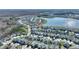 Community aerial view showcasing the property location near a scenic lake and surrounded by beautiful homes at 4608 Egg Harbor Dr, Kissimmee, FL 34746