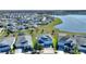 Stunning aerial view of the community, showcasing beautiful homes and a serene lake at 4608 Egg Harbor Dr, Kissimmee, FL 34746