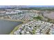Aerial view of the community near a lake, highlighting its proximity to attractions like Epcot, Disney Springs, and Magic Kingdom at 4608 Egg Harbor Dr, Kissimmee, FL 34746