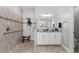 Accessible bathroom featuring a walk-in shower, grab bars, granite countertops, and a spacious layout at 4608 Egg Harbor Dr, Kissimmee, FL 34746