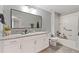 Bright bathroom features a granite vanity top, modern fixtures, framed mirror, and a shower-tub combination at 4608 Egg Harbor Dr, Kissimmee, FL 34746